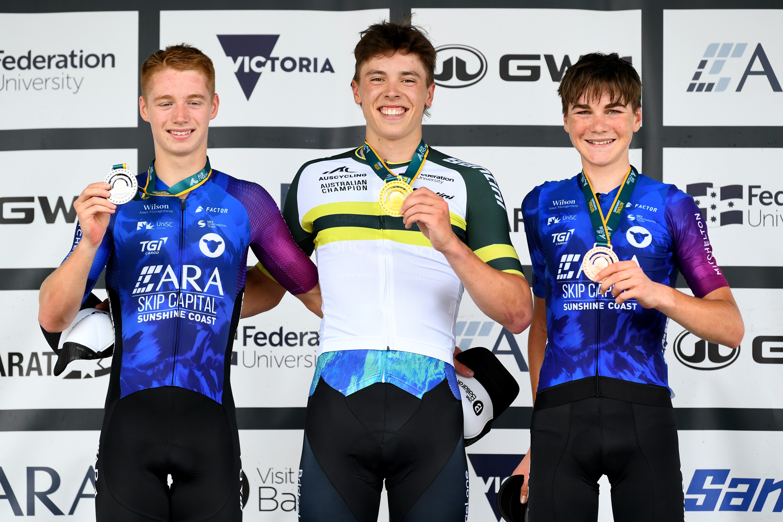 Toby Inglis, Wil Holmes and Max Goold on the podium of the 2024 junior men's road race national championship in Ballarat